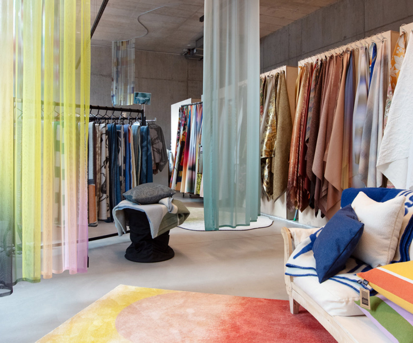 Curved sheer curtain installation and textile rails in the showroom
